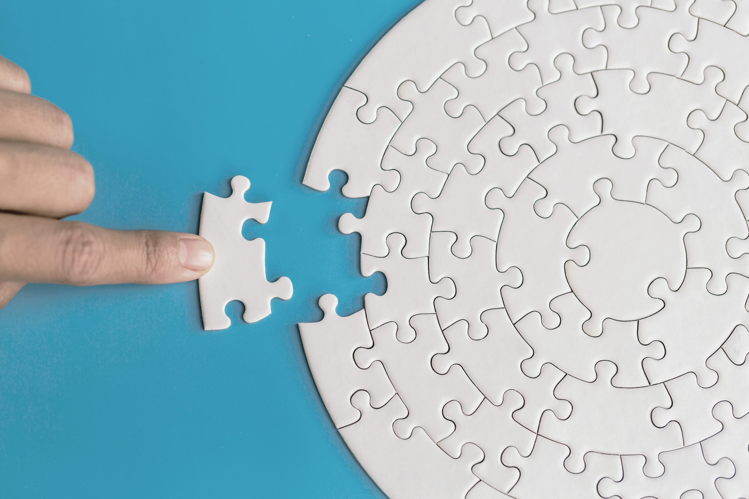 Hand Put The Last Piece Of Jigsaw Puzzle To Complete The Mission